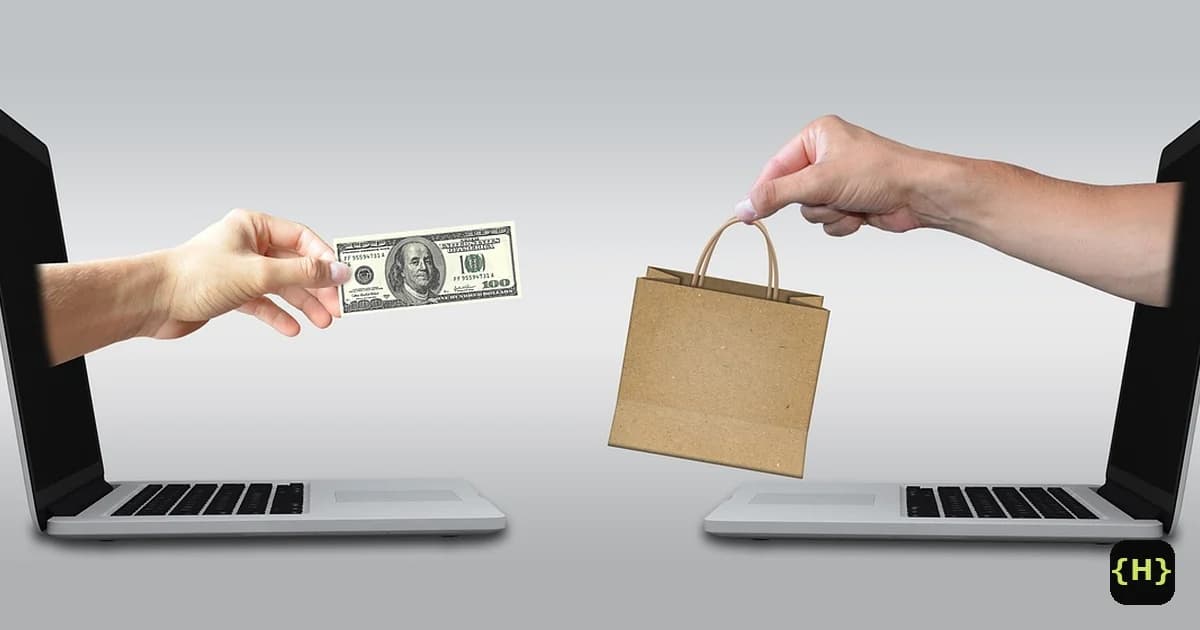 Two laptops facing each other, one hand offering a hundred-dollar bill and the other a shopping bag, illustrating an online store sale in a WooCommerce versus Shopify comparison